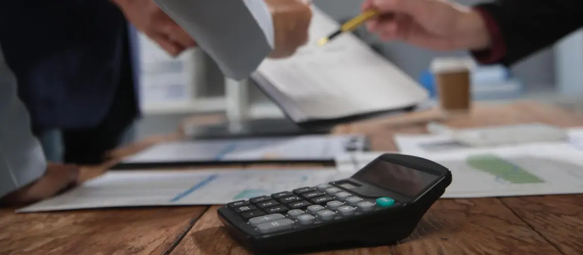 A property valuer calculating valuation costs in Hobart
